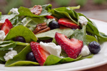Spinach Salad with Strawberries Blueberries Pecans and Goat Cheese